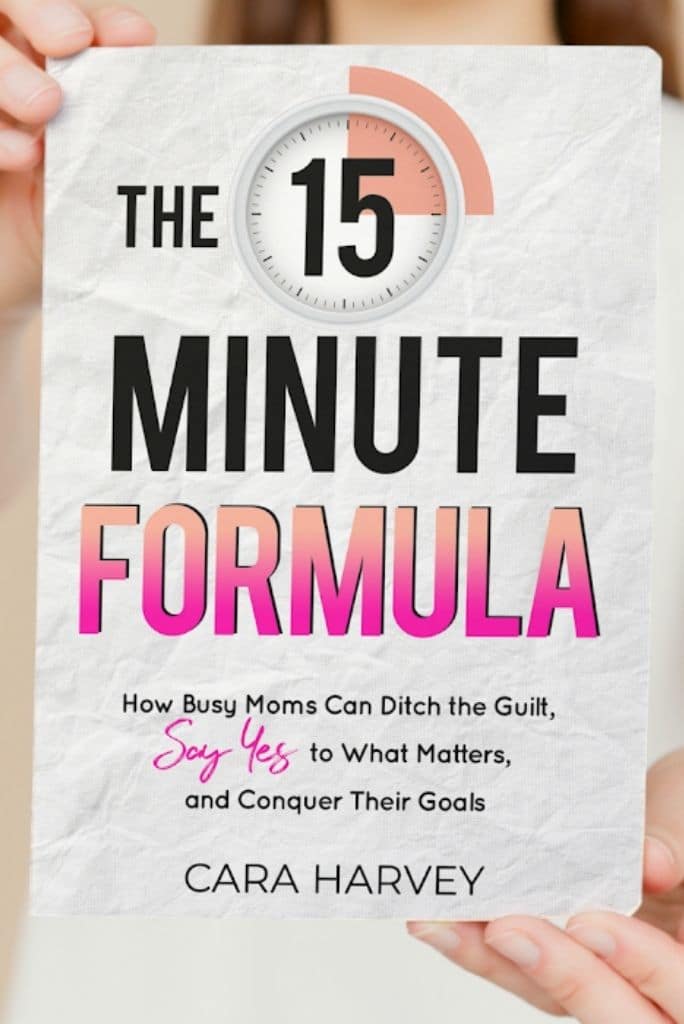 woman holding The 15 Minute Formula paperback
